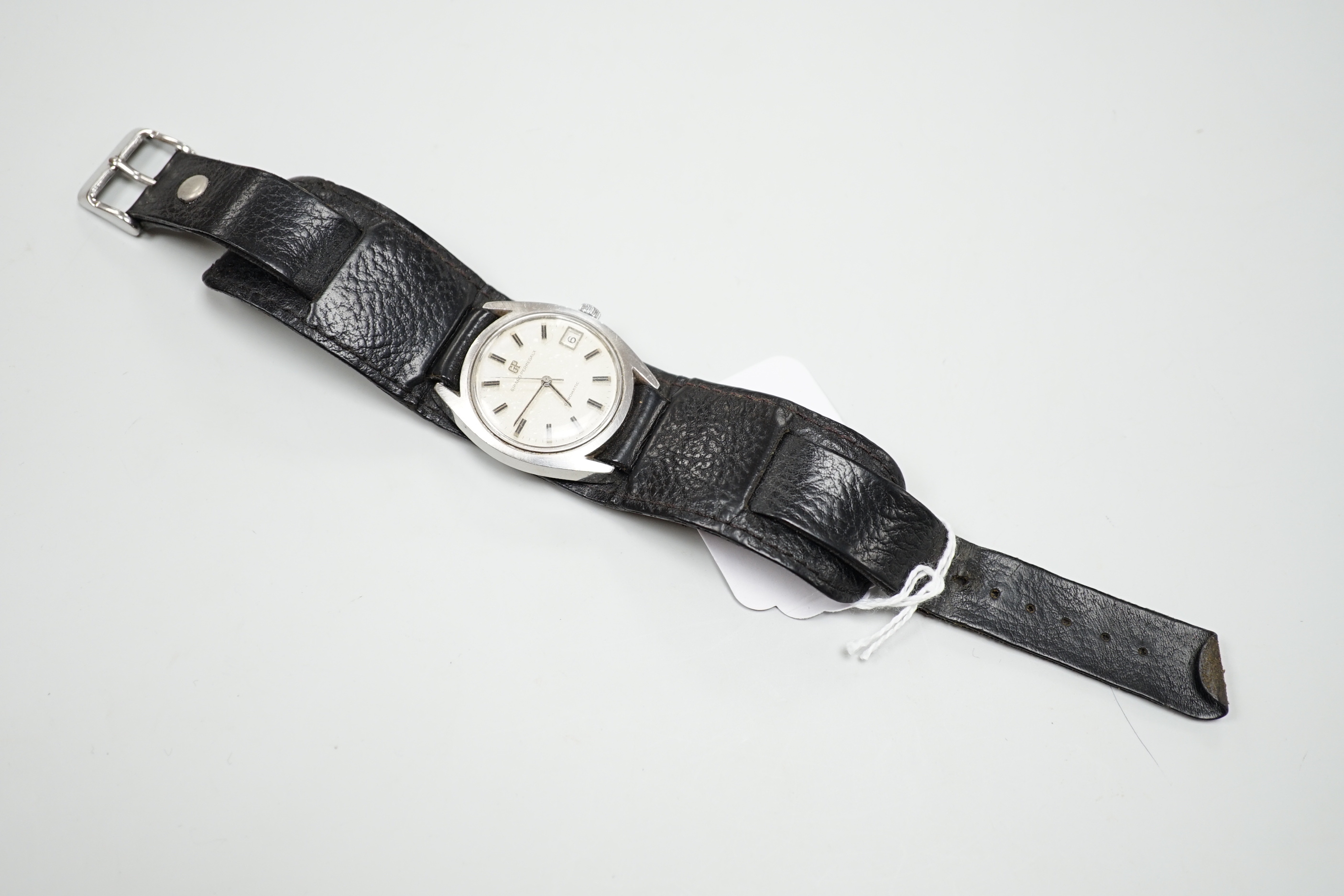 A gentleman's steel Girard Perregaux Gyromatic wrist watch, with original box and guarantee dated 1971
